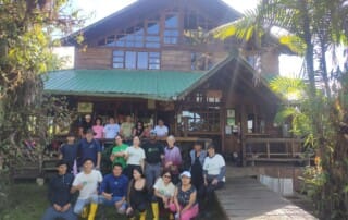 Los Cedros Scientific Station staff with Santa Lucía Reserve staff outside the lodge